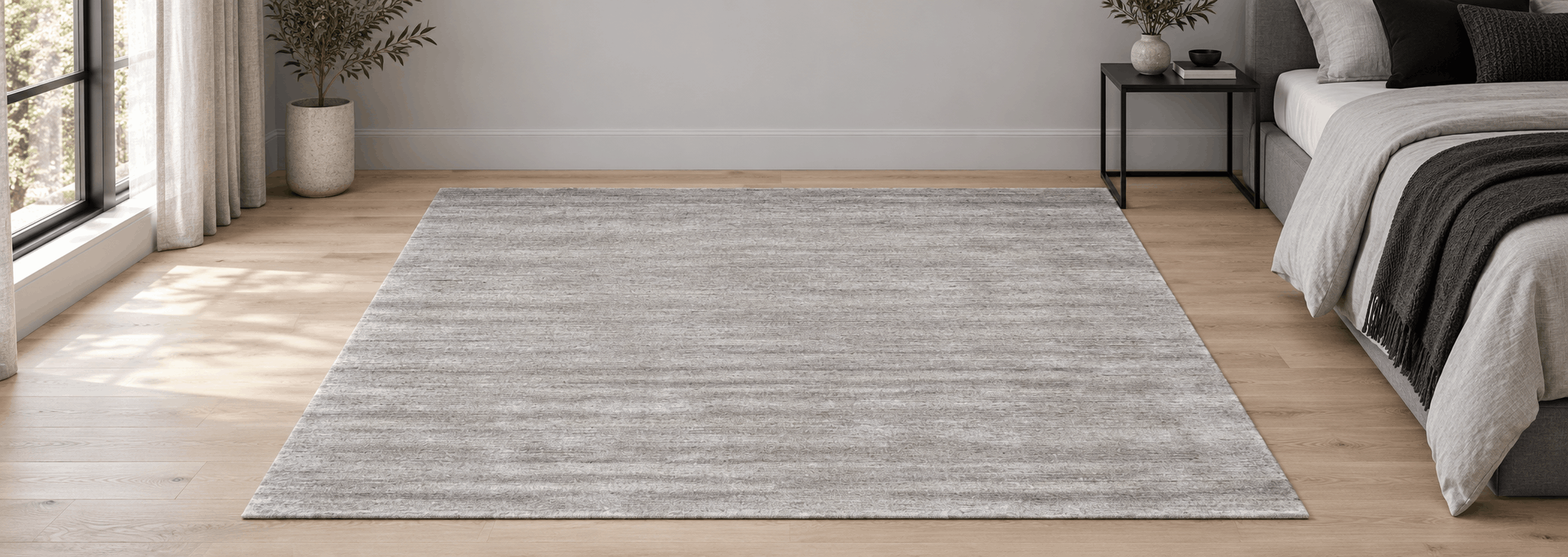 Macro detail of natural wool knots and soft grey abrash texture in an oriental rug