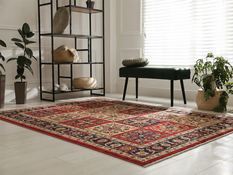 Inspecting a high-quality hand-knotted Isfahan wool rug for weave symmetry